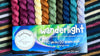 Colorful yarn set with a 'wanderlight' label on a striped fabric background